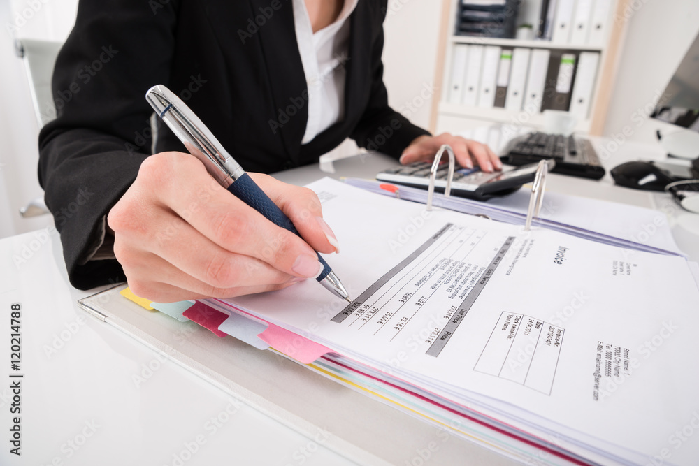 Businesswoman Hand Calculating Business Report Businesswoman Hand Calculating Business Report
