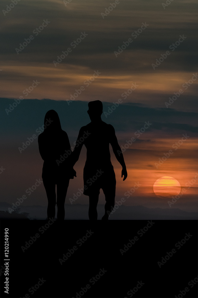Sunset Scene of Couple Silhouette Holding Hands