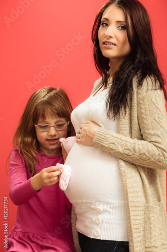 pregnant woman with her daughter
