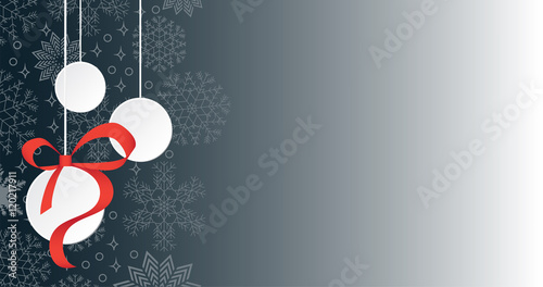 Three hanging Christmas balls on snowing background and copy space