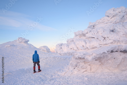Tourist walks in the winter mountains