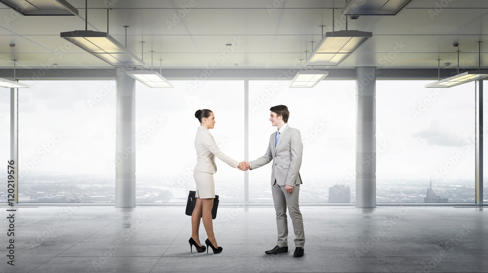 Fototapeta premium Business partners handshake . Mixed media