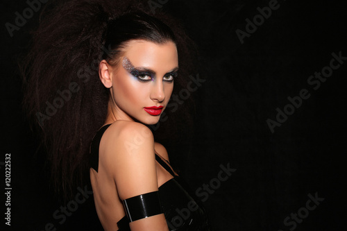Woman with adhesive tape on her body. Close up. Black background