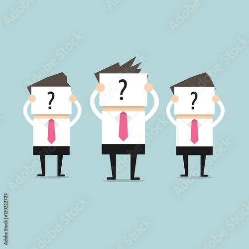 Businessman hold signs with question marks, as yet unable to determine who they are.