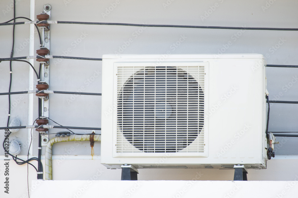 air-conditioner mounted outside on a wall air-conditioner mounted outside on a wall