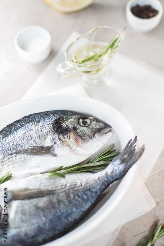 Fresh dorado fish with herbs and pepper Fresh dorado fish with herbs and pepper