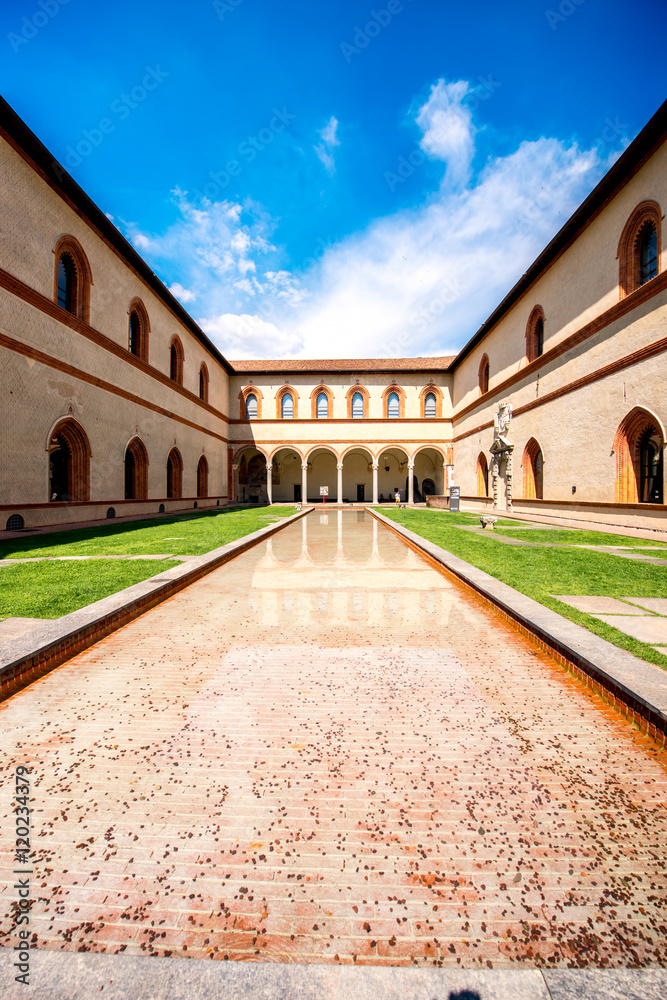 Fototapeta premium Inner yard of Sforza castle with fountain in Milan city