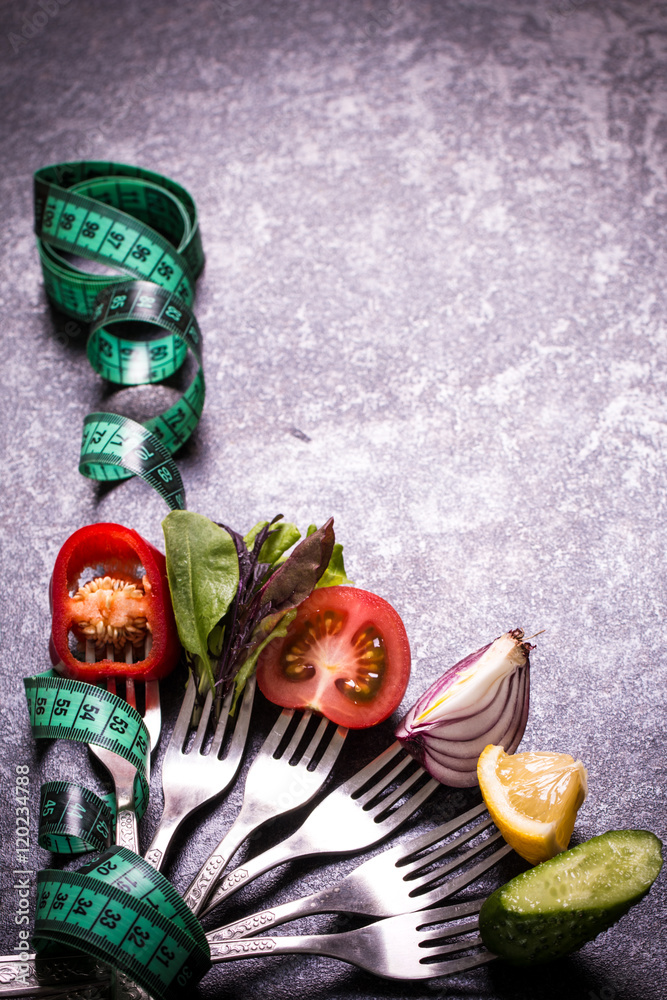 Fresh mixed vegetables on fork ,black background