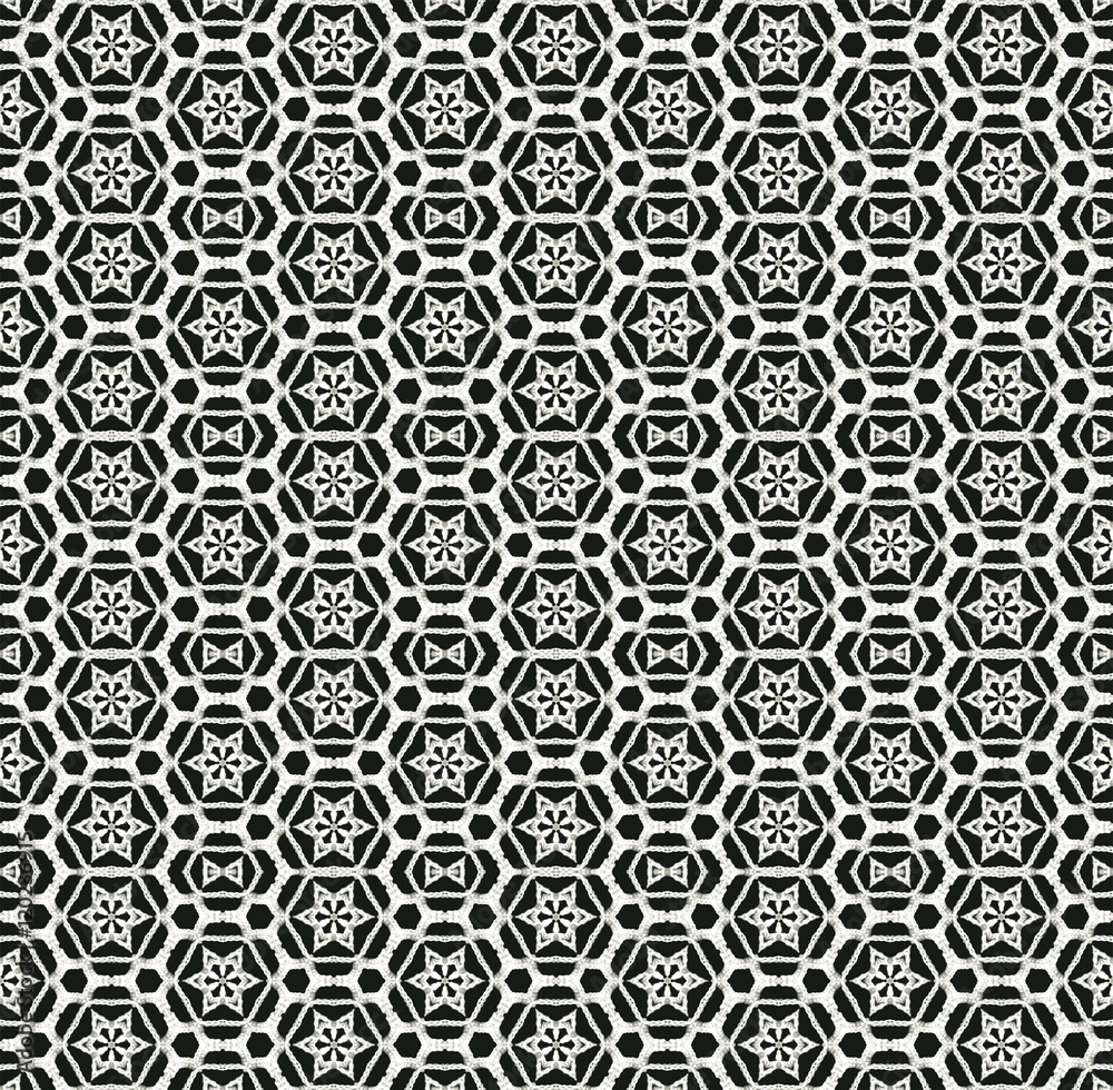 Black and white monochrome seamless pattern background made of repeating scanned elements of handmade crochet lace