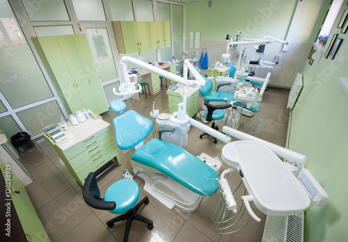Dentist office with three modern dental units for restorative dentistry. Stomatology. View from above. Medical equipment