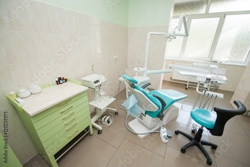 Dental clinic interior design with chair and tools. Dental chair  equipment and other accessories used by dentists. Surgery. Dentistry
