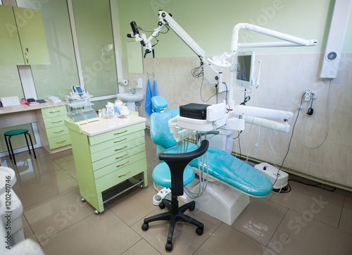 Dental clinic interior design with chair and tools. Dental chair, equipment and other accessories used by dentists. Dentistry