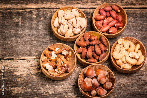 Mix nuts on wooden table,healthy vegan food.
