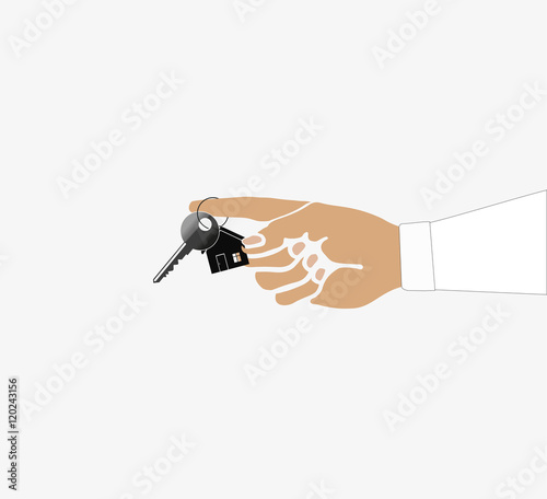 Man holding out house key on a house shaped keychain.