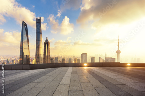 cityscape and skyline of shanghai from empty brick floor