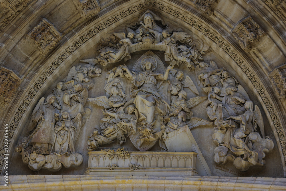 High-relief tympanum of a Gothic cathedral, Seville, Spain