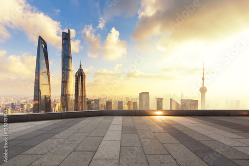 cityscape and skyline of shanghai from empty brick floor