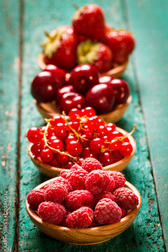 Fresh summer berries , wooden background, healthy food.
