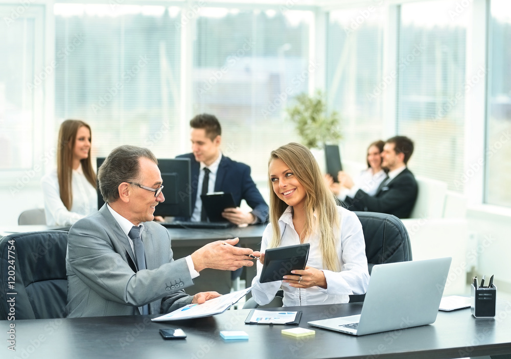 successful businessman and his assistant discuss the work plan successful businessman and his assistant discuss the work plan