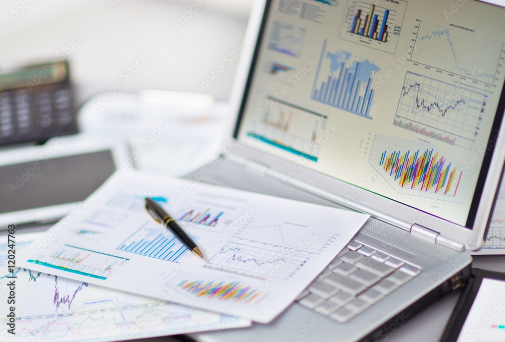 Businessman analyzing investment charts with laptop. Accounting Businessman analyzing investment charts with laptop. Accounting