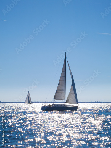 sailing boats navigating in the sea in summer with sun reflectio © Tommaso Lizzul