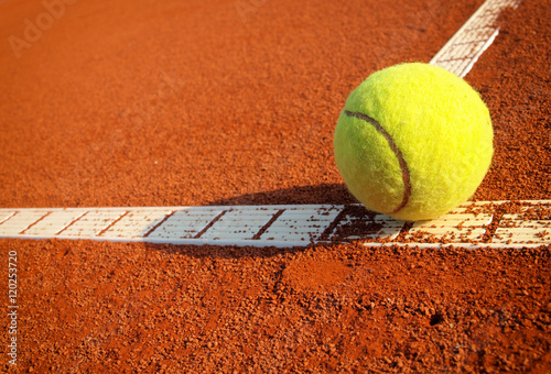 Tennis ball on a tennis clay court © Željko Radojko