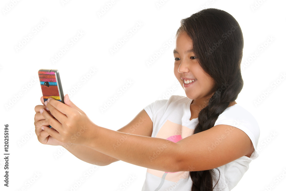 Beautiful little girl making a selfie on smartphone Beautiful little girl making a selfie on smartphone