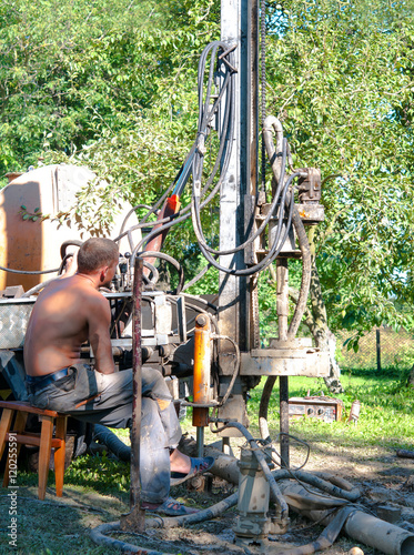 man drilling photo