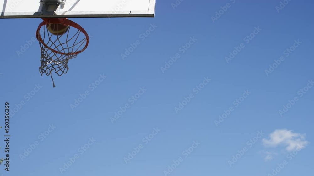 Basketball flies through the air and misses, in slow motion Basketball flies through the air and misses, in slow motion