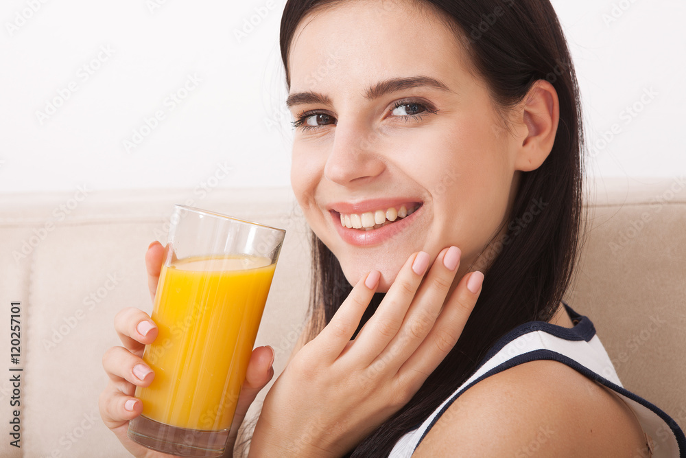 Woman drinking orange juice Beautiful mixed-race Asian, Caucasian model. Woman drinking orange juice Beautiful mixed-race Asian, Caucasian model.