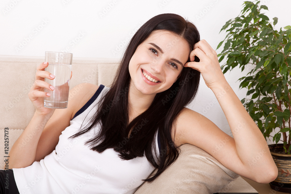 Girl drinking water at home. Glass of water in morning before breakfast. Girl drinking water at home. Glass of water in morning before breakfast.