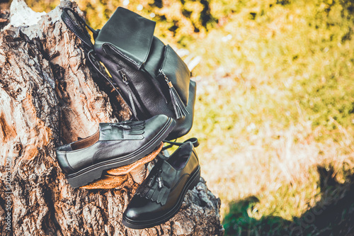 black leather shoes and a backpack, women's shoes