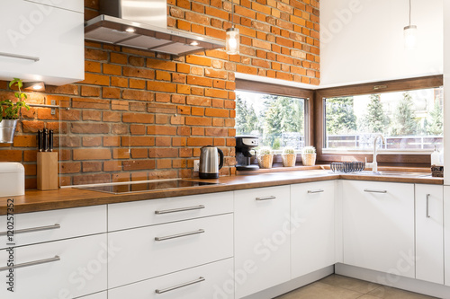 Kitchen with brick wall photo