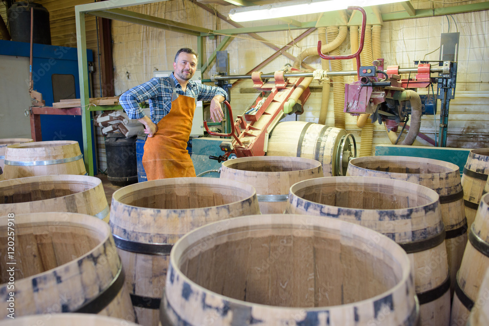 wood barrels production cooper using hammer and tools in workshop wood barrels production cooper using hammer and tools in workshop