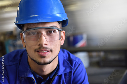 Portrait of young metalwork trainee in workshop