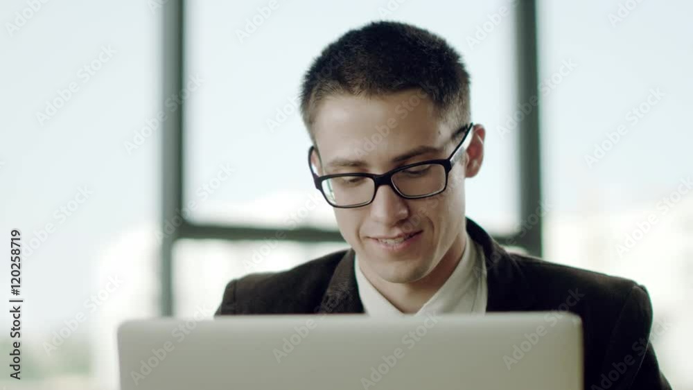 happy businessman looks at camera happy businessman looks at camera