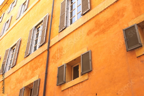 Windows of old house. Mediterranean architecture in Rome, Italy.
