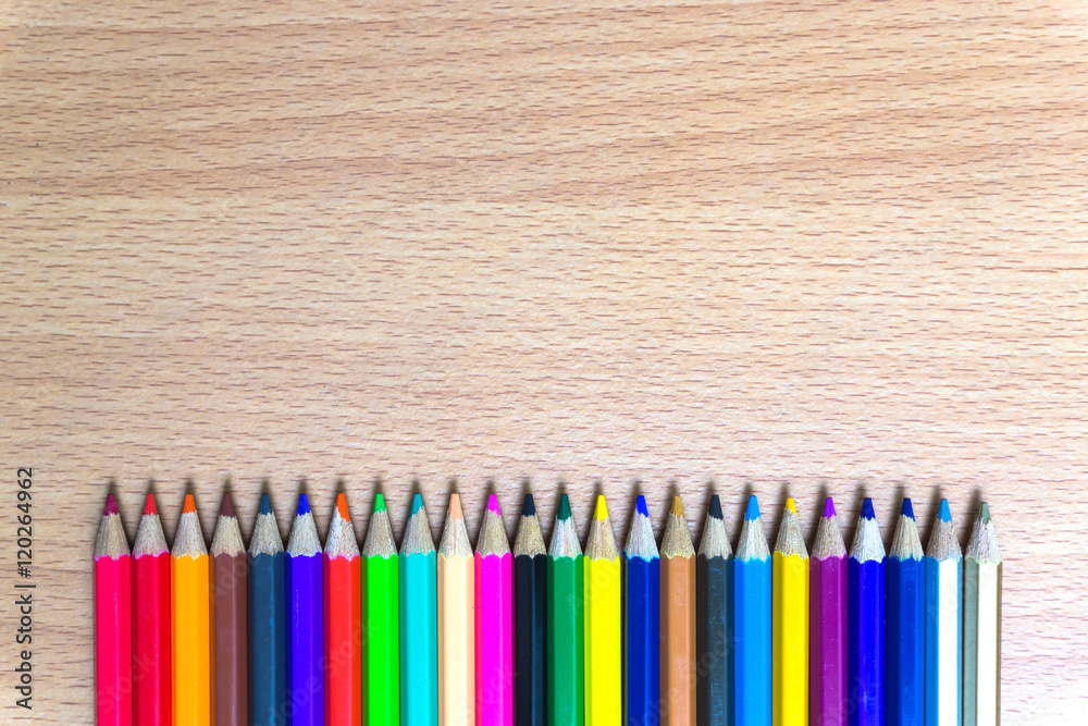 Colored pencils on a wooden board Colored pencils on a wooden board