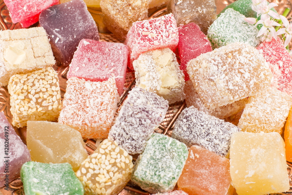 Turkish delight lokum in various colors on a plate Turkish delight lokum in various colors on a plate