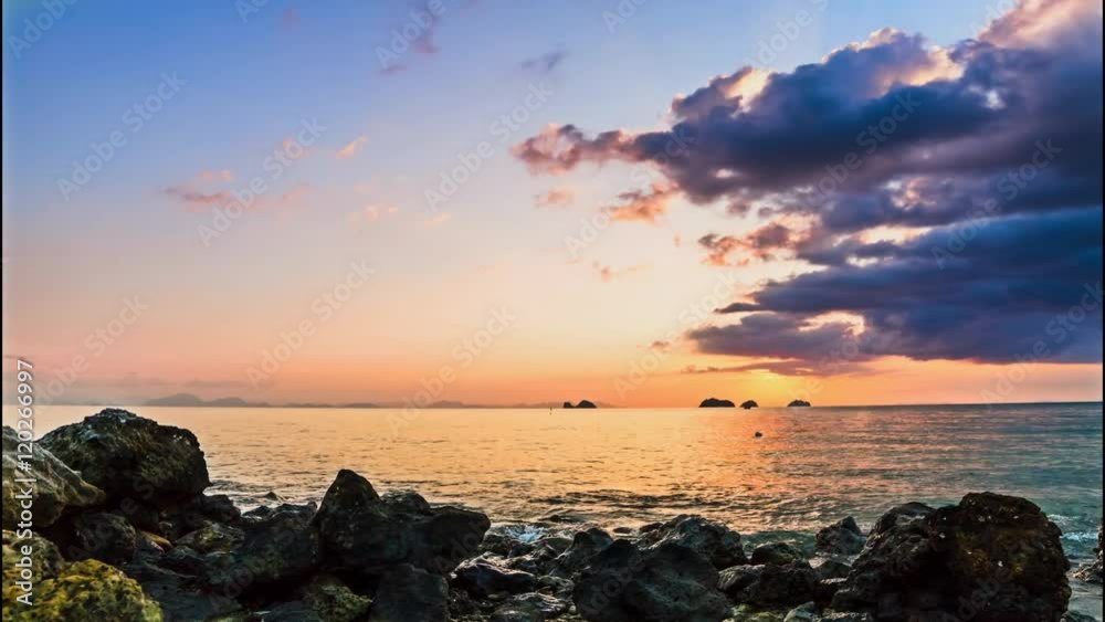 Beautiful clouds over a sea at sunset with brilliant colors.Sunbeam in the multicolor sky. 4K time lapse. Beautiful clouds over a sea at sunset with brilliant colors.Sunbeam in the multicolor sky. 4K time lapse.