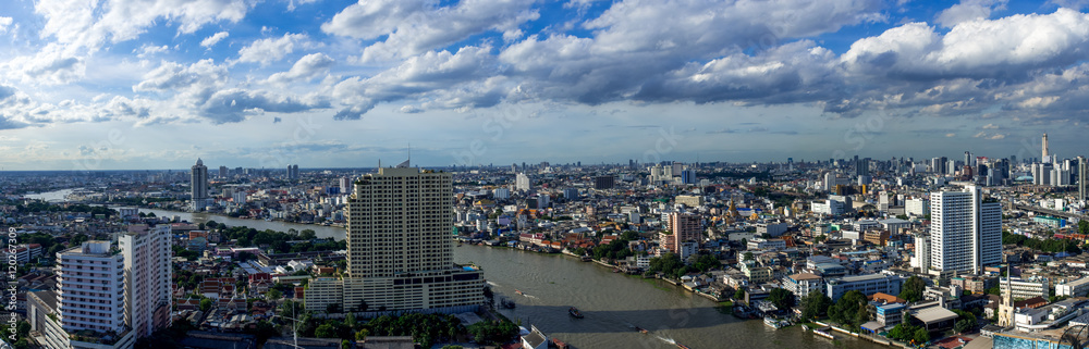 panoramic Bangkok cityscape with Chaopraya river on blue sky day