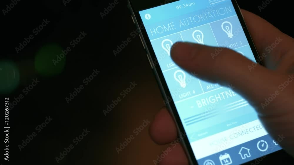 smart house, home automation, device with app icons. Man uses his mobile phone with smarthome app to control his house. the new generation of the internet of things.