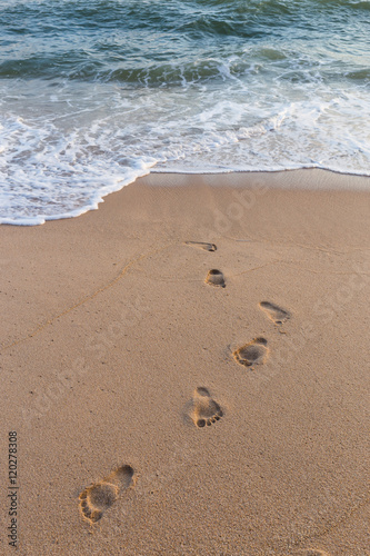 Footprints on the sand beach