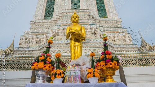 Buddha gold statue and thai art architecture in Wat Arun buddhist temple in Bangkok, Thailand.Selective focus. photo