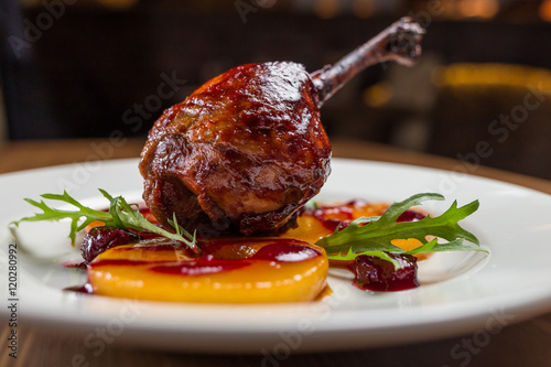 Duck confit on white plate, restsurant