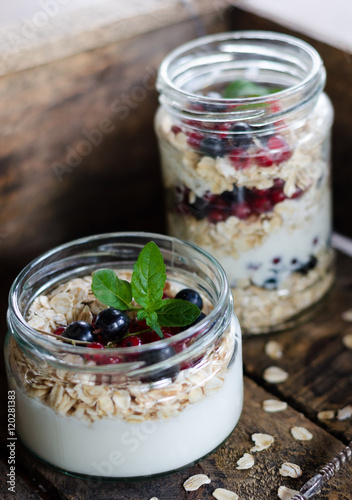 yogurt with berries and products for healthy breakfast, close-up
