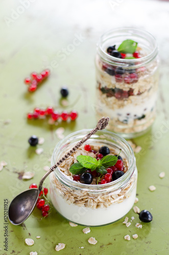 yogurt with berries and products for healthy breakfast, close-up
