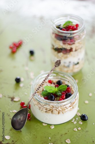 yogurt with berries and products for healthy breakfast, close-up
