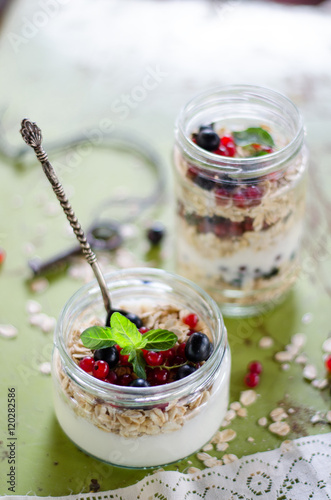 yogurt with berries and products for healthy breakfast, close-up
