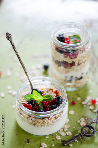 yogurt with berries and products for healthy breakfast, close-up
